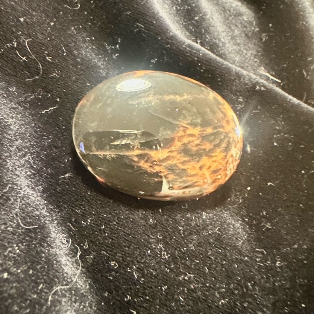 Oval Polished Stone with Orange and Black Patterns